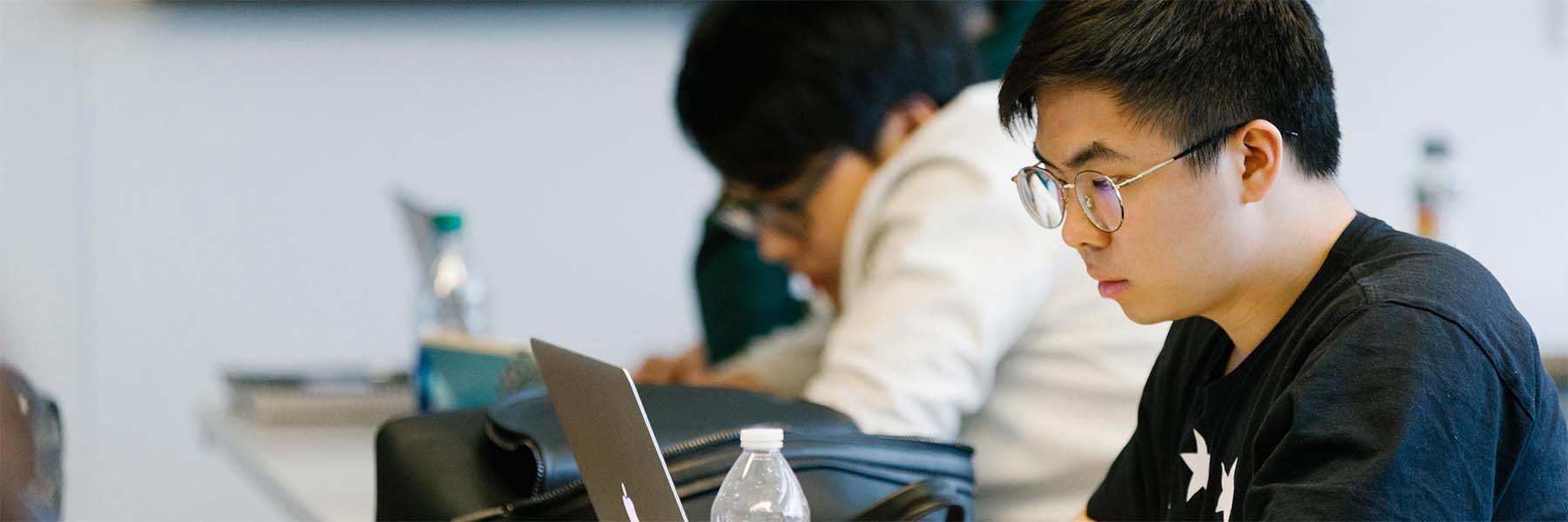student focusing on laptop